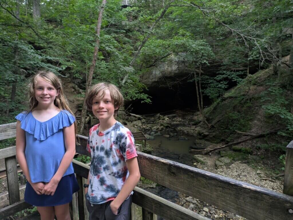 2 kids in from of the Rock Bridge at Rock Bridge Memorial State Park