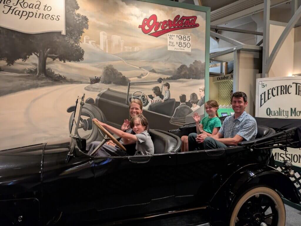 Family in old car