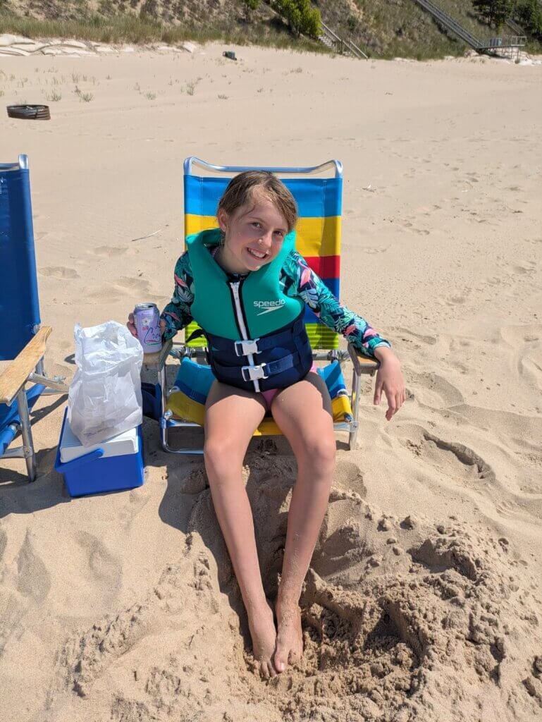 Girl at beach in chair