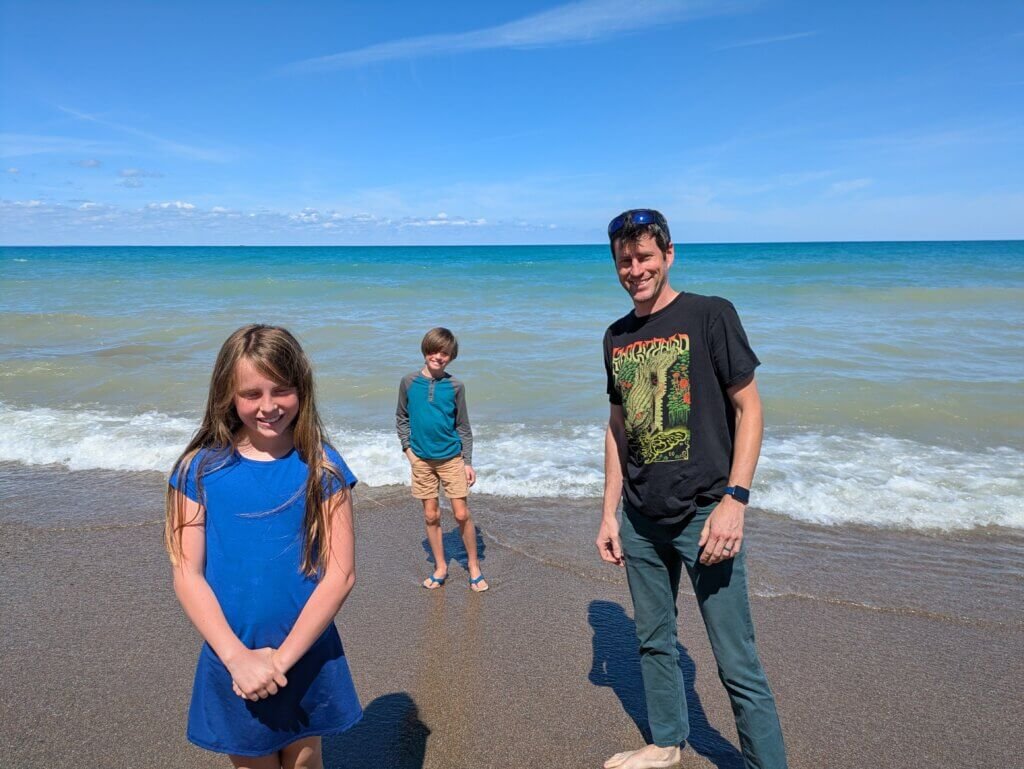 people standing on shore