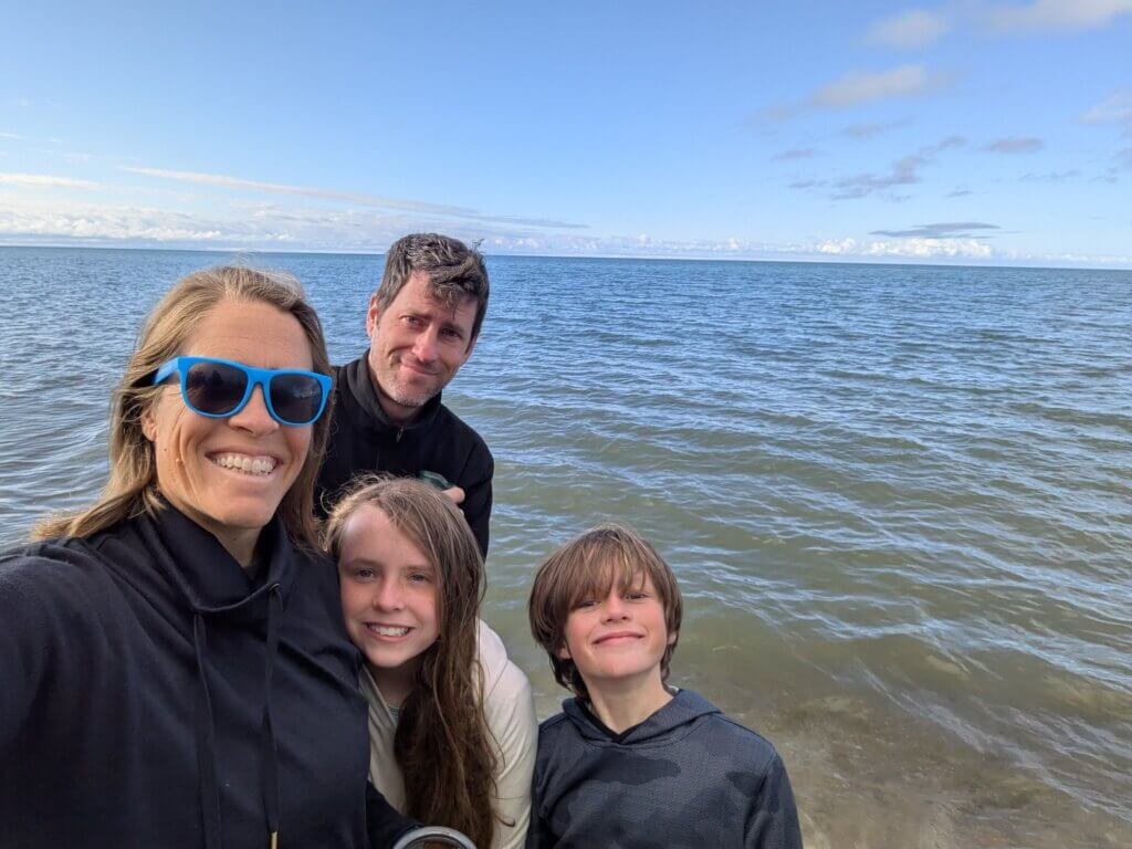 Family in front of lake